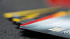Several bank cards are located on a table
