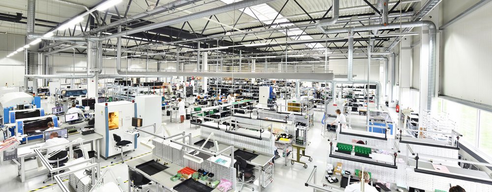 Electrical components are produced in modern factories.